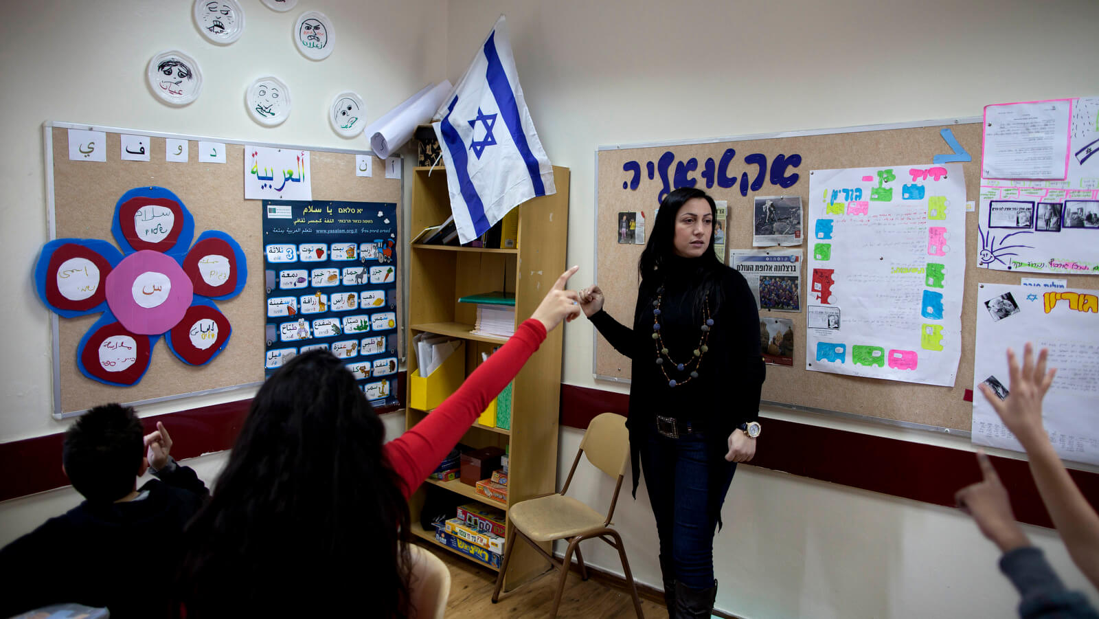 An Israeli Arab teacher from the Arab town of Kabul gives an Arabic class to Israeli schoolchildren in a school in the Jewish village of Yokneam, Dec 20, 2011. Oded Balilty | AP