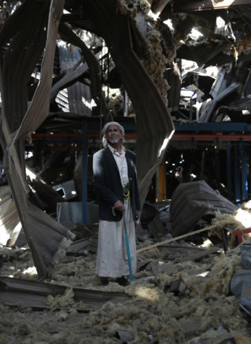 An elderly man stands among the rubble of the Alsonidar Group's water pump and pipe factory after it was hit by Saudi-led airstrikes in Sanaa, Yemen, Sept. 22, 2016. Hani Mohammed | AP