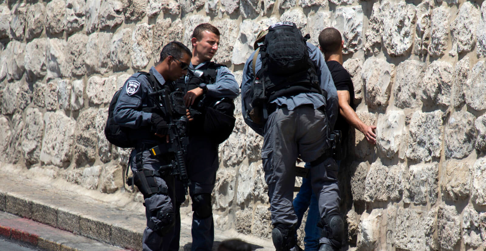 Israeli police detain a Palestinian boy outside the Lion's Gate near the Al Aqsa Mosque compound in Jerusalem's Old City, July 23, 2017. Ariel Schalit | AP