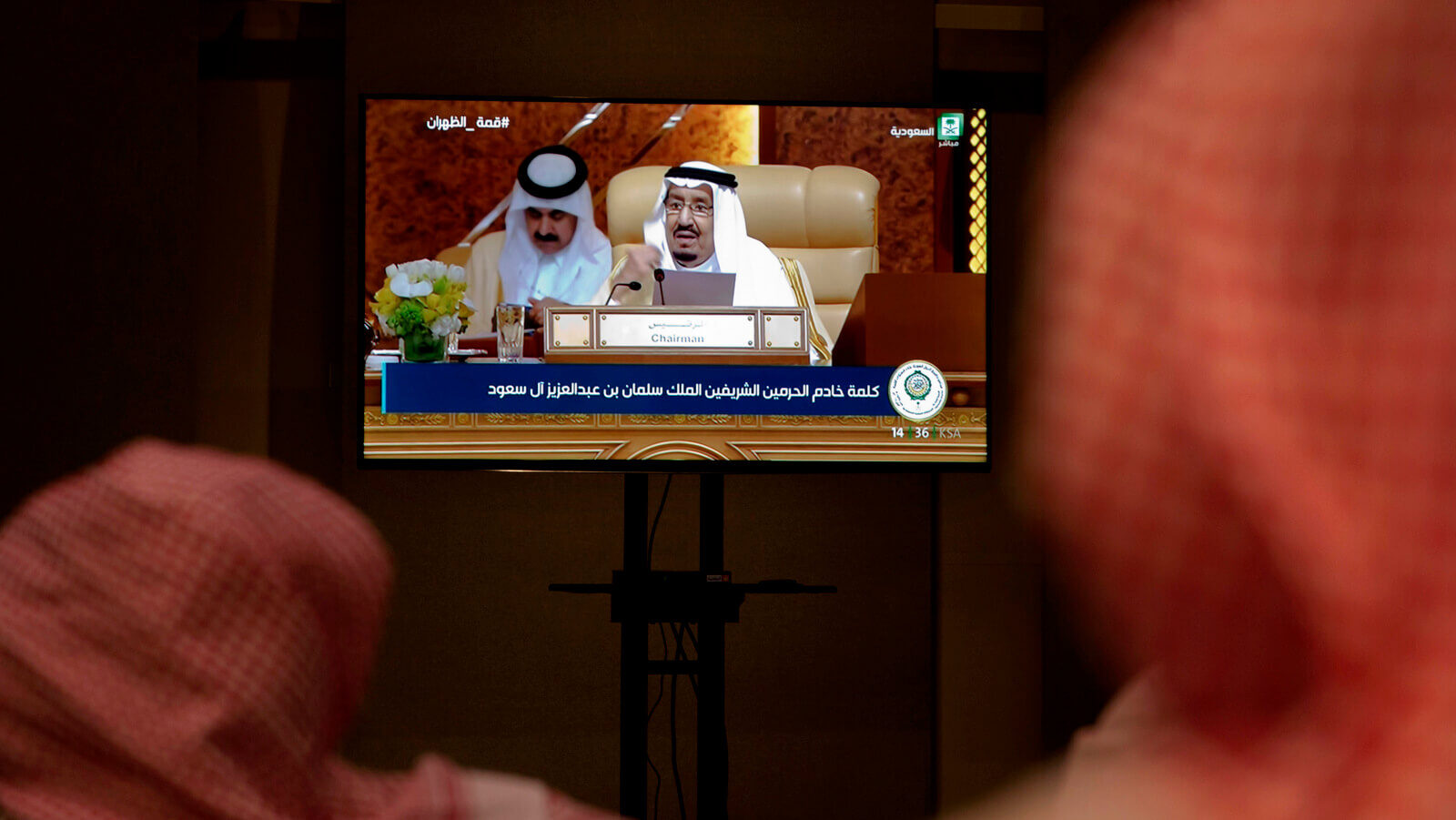 Reporters watch the speech of Saudi King Salman from a press room, during the opening of the Arab summit in Dhahran, Saudi Arabia, April 15, 2018. Amr Nabil | AP