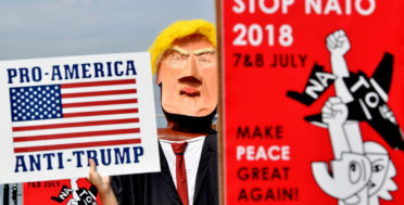 Protestors march next to giant puppet of U.S. President Donald Trump during a demonstration in Brussels, Saturday, July 7, 2018. Europeans are protesting U.S. President Donald Trump's appearance at a NATO summit, marching through Brussels to plead for less military spending and more public money for schools and clean energy. Geert Vanden Wijngaert | AP