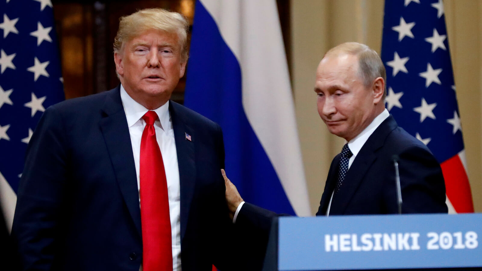 U.S. President Donald Trump, left, and Russian President Vladimir Putin leave after a press conference after their meeting at the Presidential Palace in Helsinki, Finland, July 16, 2018. Alexander Zemlianichenko | AP