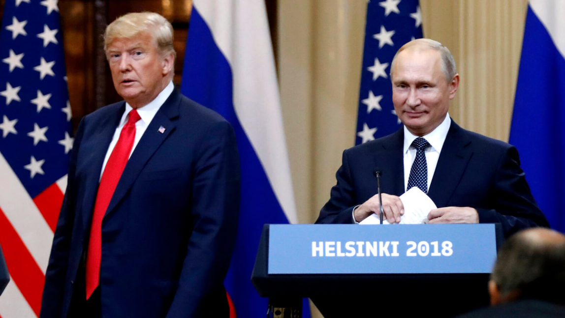 U.S. President Donald Trump, left, and Russian President Vladimir Putin arrive for a press conference after their meeting at the Presidential Palace in Helsinki, Finland. Alexander Zemlianichenko | AP