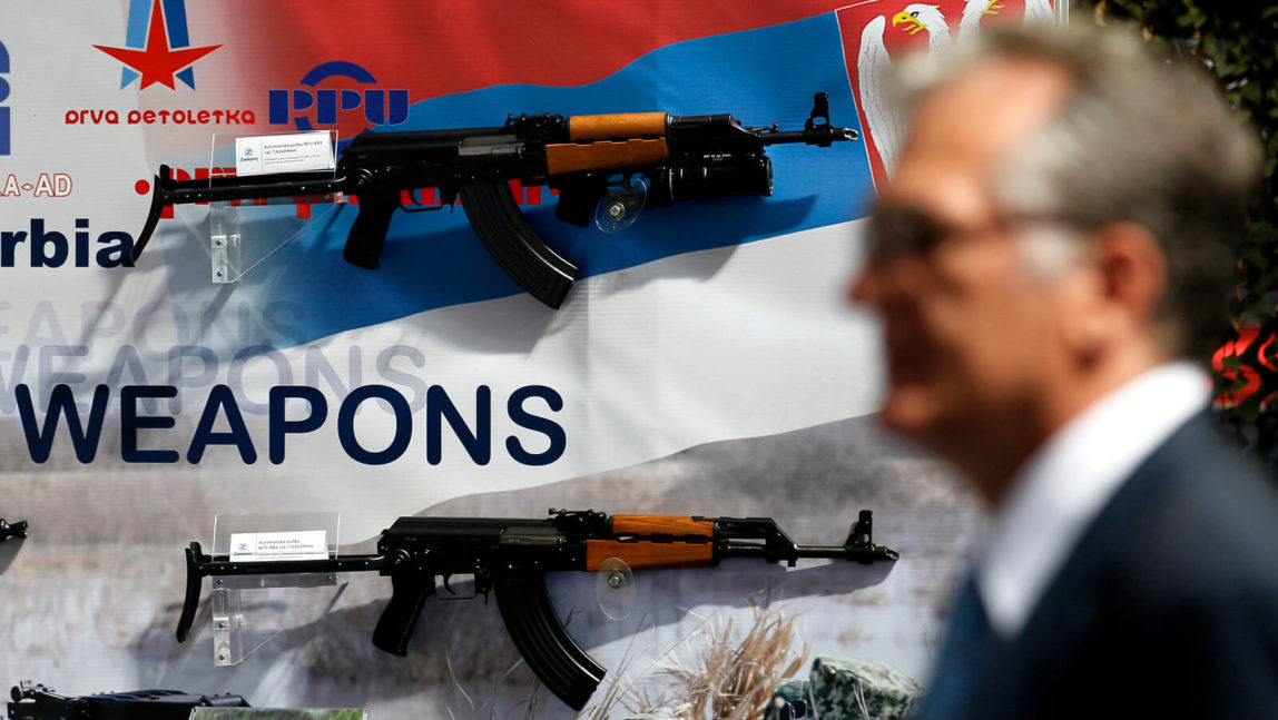 In this June 28, 2011 file photo, a visitor looks at assault rifles made by the Serbian company Zastava Arms, during a defense fair, in Belgrade, Serbia. Darko Vojinovic | AP