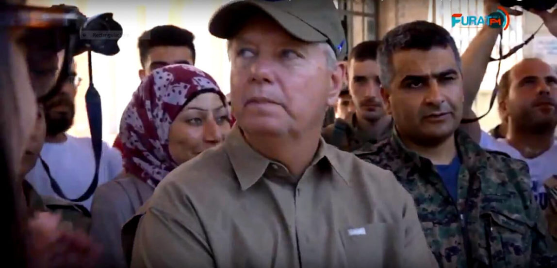 Senator Lindsey Graham visits U.S.-trained and funded Kurdish SDF militia members in Manjib, Syria.  YouTube | Screenshot