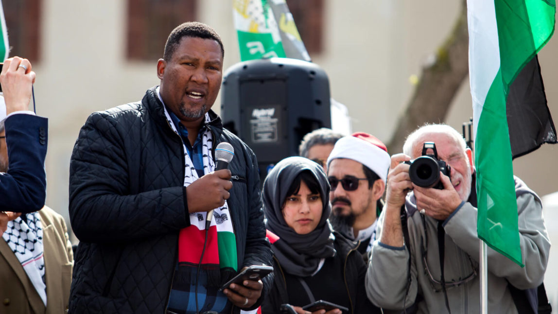 Zwelivelile "Mandla" Mandela speaks outside Parliament during a protest in Cape Town, South Africa against increased Israeli “security” measures at the Al-Aqsa Mosque in Jerusalem, July 26, 2017. Ashraf Hendricks | GroundUp