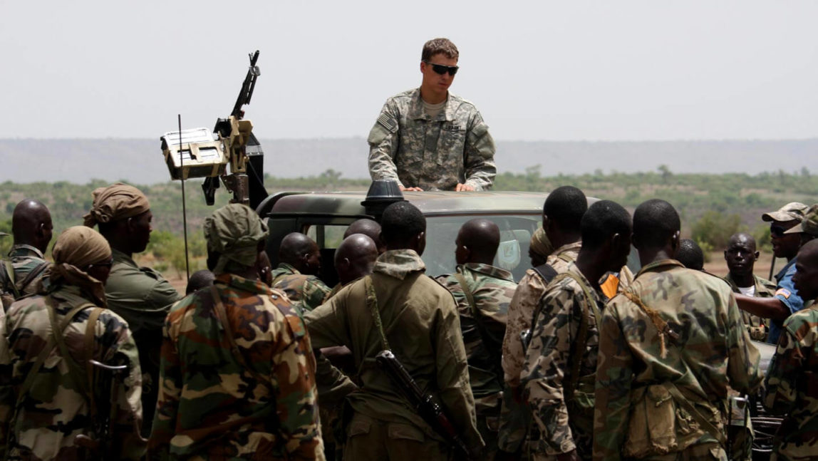 Malian special forces listen to instructions from a US Special Forces soldier in Kita, Mali. Alfred de Montesquiou | AP