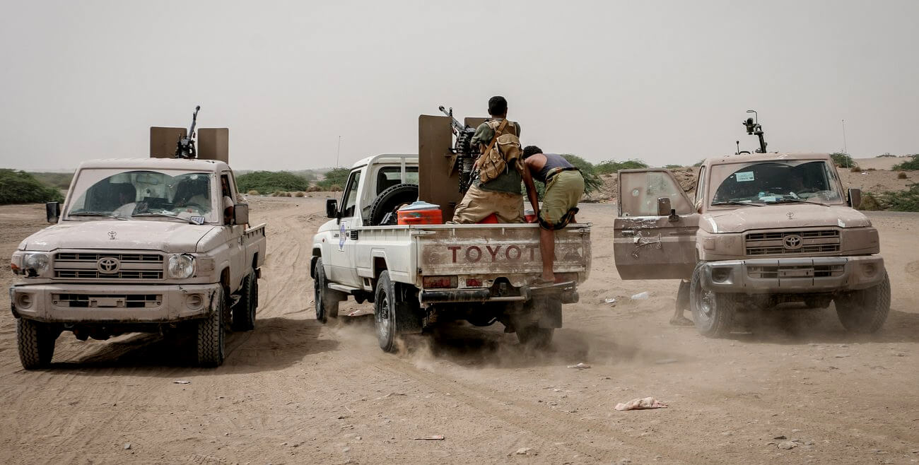 Yemeni tribal forces emplyed by the Saudi-led coalition take position during an attack on the port city of Hodeida, Yemen, 28 June 2018. Taleb Almamari | AP