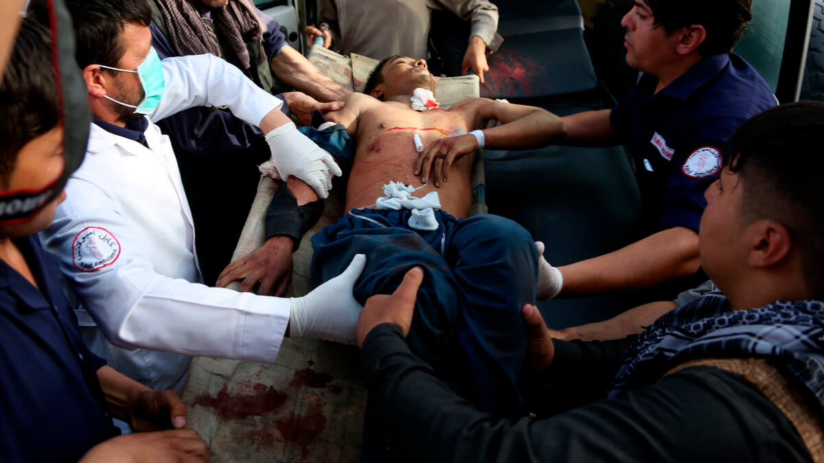 A man who was injured in a deadly suicide bombing that targeted a training class in a private building in the Shiite neighborhood of Dasht-i Barcha is placed in an ambulance in western Kabul, Afghanistan, Wednesday, Aug. 15, 2018. Both the resurgent Taliban and an Islamic State affiliate in Afghanistan have targeted Shiites in the past, considering them to be heretics. (AP Photo/Rahmat Gul)
