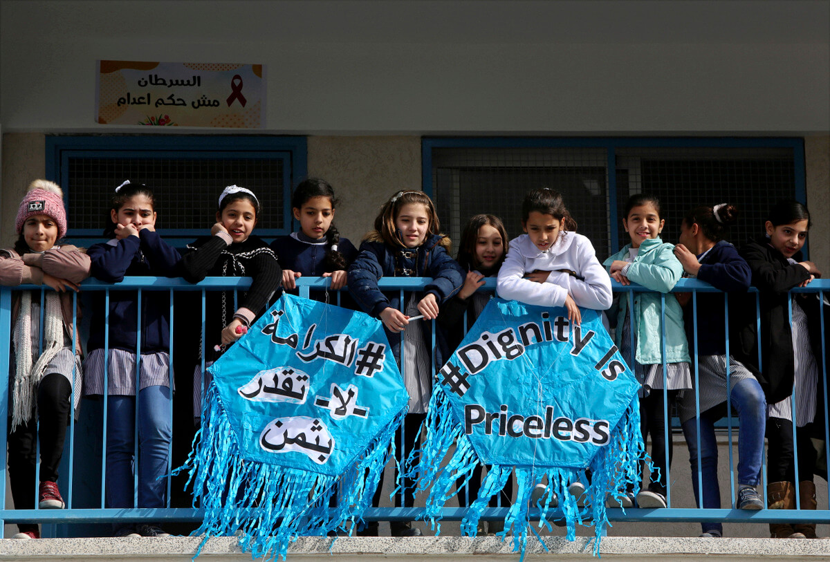 School girls listen to Mr. Pierre Krähenbühl, Commissioner-General of the United Nations Relief and Works Agency for Palestine Refugees, during the launch of a global campaign to support UNRWA, at the UNRWA Rimal Girls Preparatory School in Gaza. Adel Hana | AP