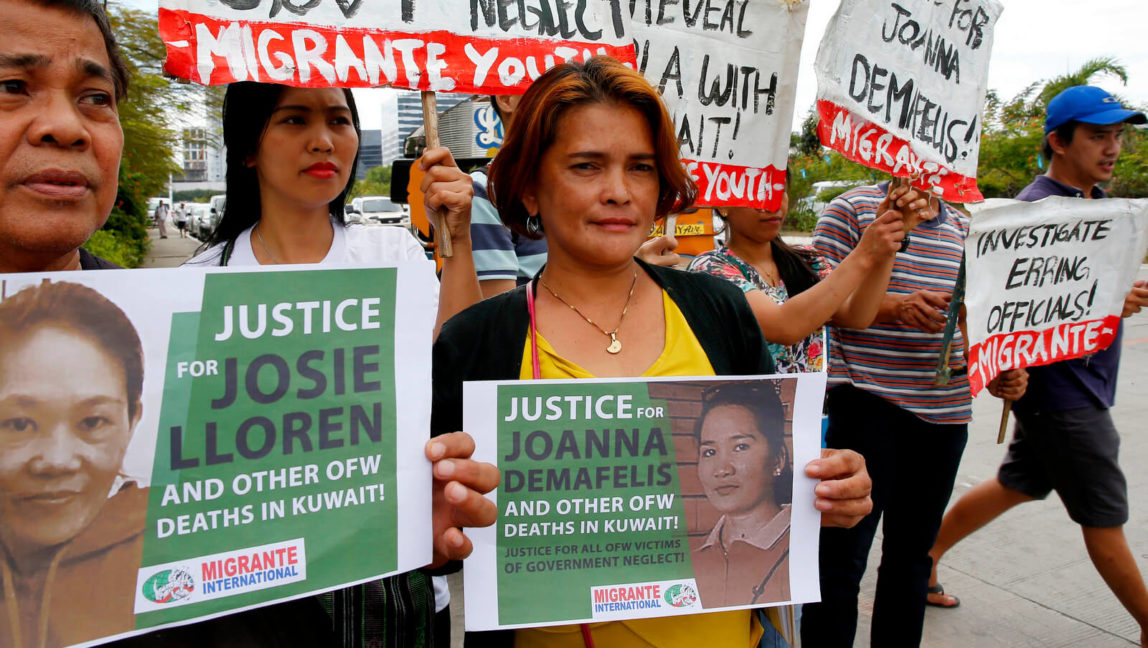 Protesters picket the Senate at the start of the probe in the death of an overseas worker in Kuwait, Pasay city south of Manila, Philippines