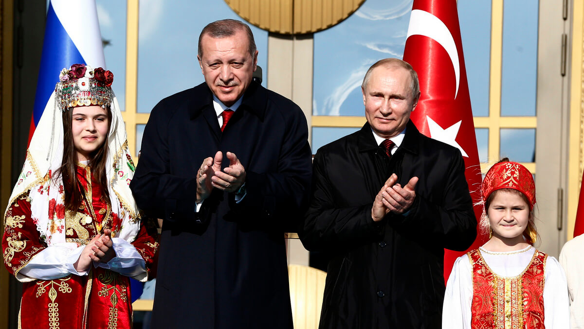 Turkey's President Recep Tayyip Erdogan and Russia's President Vladimir Putin applaud during a welcome ceremony, in Ankara, Turkey, April 3, 2018. Burhan Ozbilici | AP