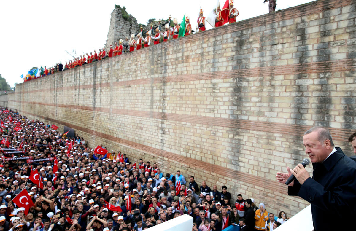 Turkey's President Recep Tayyip Erdogan addresses supporters at a rally in Istanbul where he expressed support for American, British and French military operations in Syria, April 14, 2018. Yasin Bulbul | AP