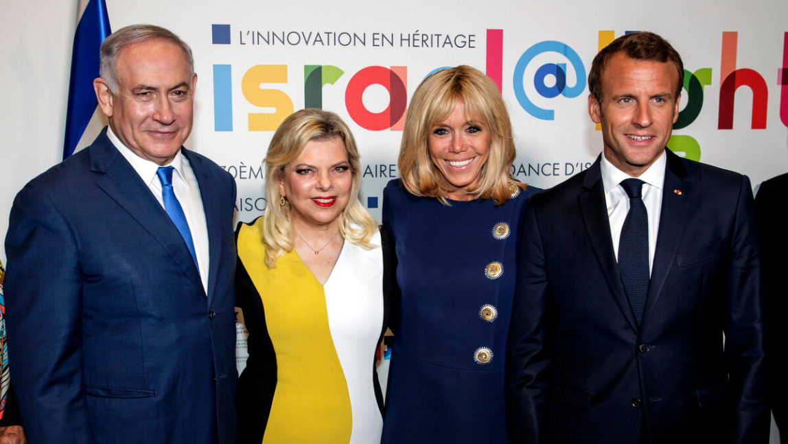 From left, Israel's Prime Minister Benjamin Netanyahu, his wife Sara Netanyahu, French President Emmanuel Macron and his wife Brigitte Macron pose during the opening ceremony of the France-Israel season event, in Paris, June 5, 2018. Christophe Petit Tesson | Pool via AP