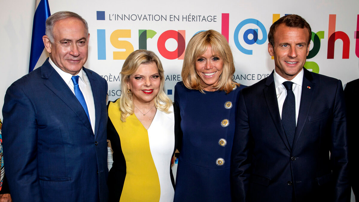 From left, Israel's Prime Minister Benjamin Netanyahu, his wife Sara Netanyahu, French President Emmanuel Macron and his wife Brigitte Macron pose during the opening ceremony of the France-Israel season event, in Paris, June 5, 2018. Christophe Petit Tesson | Pool via AP