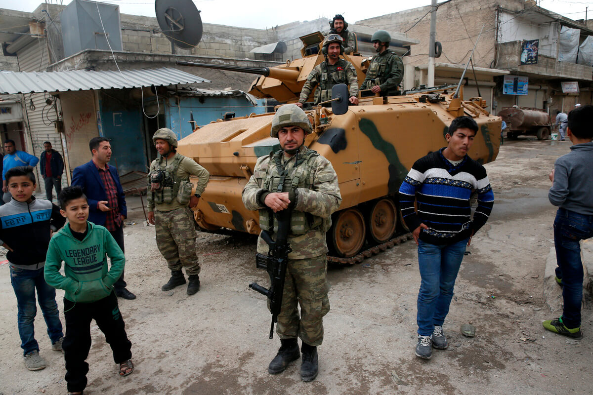 Turkish soldiers patrol Afrin, Syria, during a Turkish government-organized media tour, March 24, 2018. Lefteris Pitarakis | AP