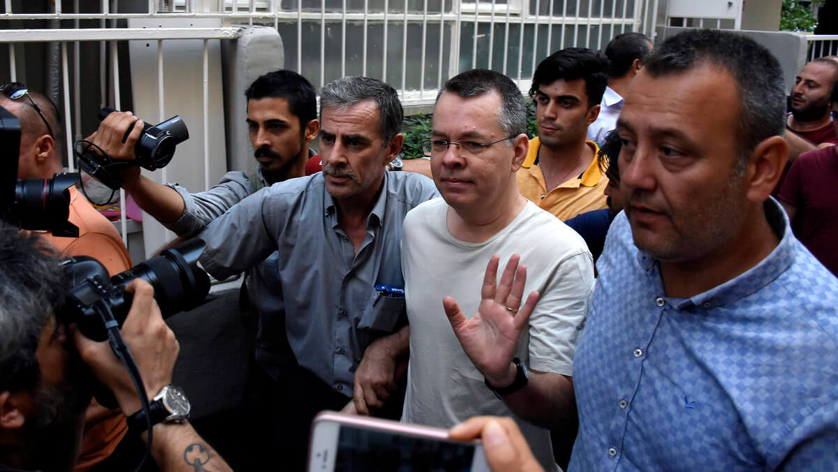 American Pastor Andrew Craig Brunson, a 50-year-old evangelical pastor from Black Mountain, North Carolina, center, waves as he leaves a prison outside Izmir, Turkey, July 25, 2018. DHA | AP