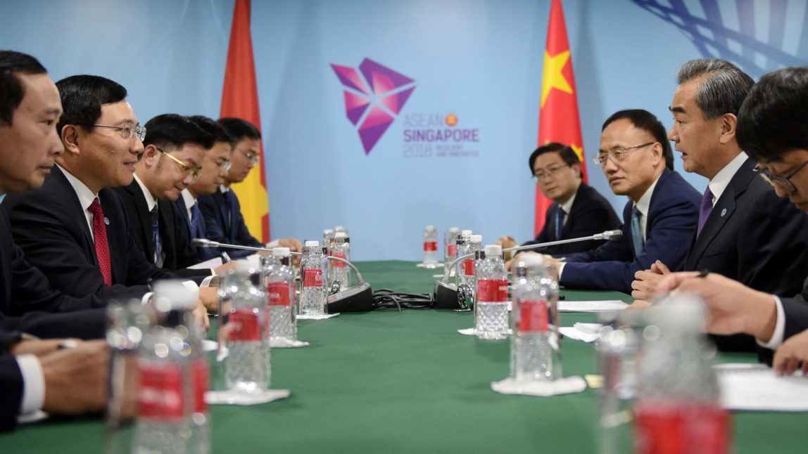 China's Foreign Minister Wang Yi, right, and Vietnam's Foreign Minister Pham Binh Minh at a bilateral meeting on the sidelines of the 51st ASEAN Foreign Ministers Meeting in Singapore, Aug. 3, 2018. Joseph Nair | AP