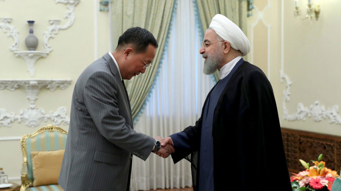 President Hassan Rouhani, right, greets North Korean Foreign Minister Ri Yong Ho at the start of their meeting, at the presidency office, in Tehran, Iran, Aug. 8, 2018. Iranian Presidency Office via AP