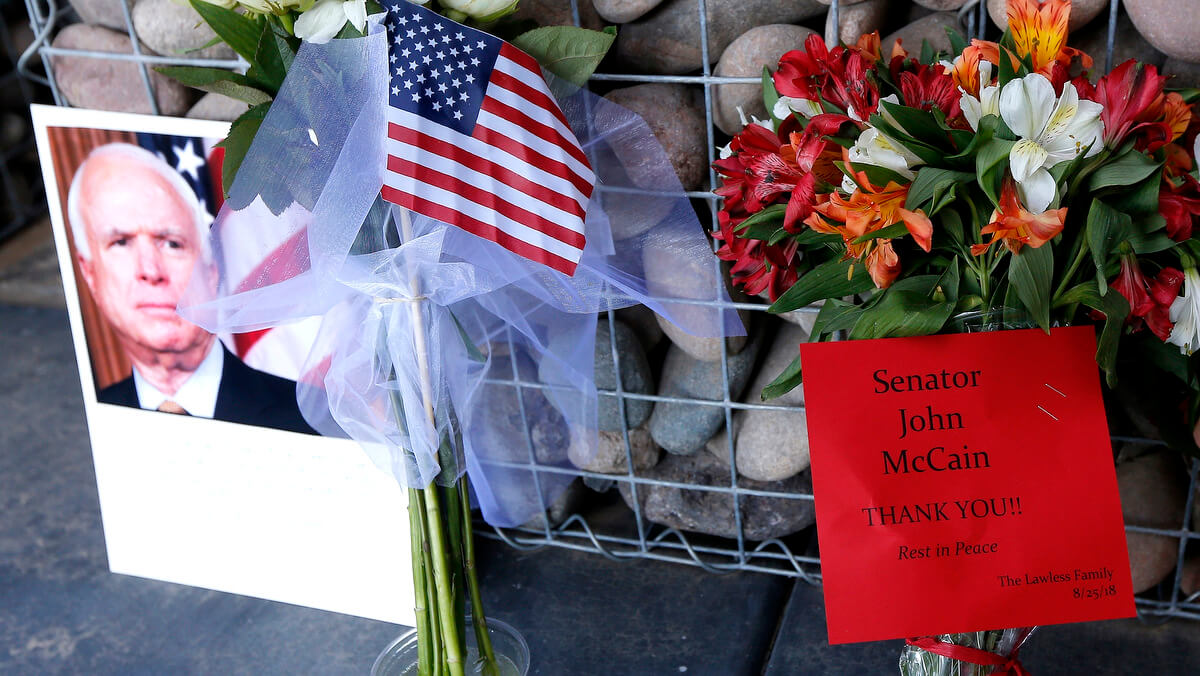 A makeshift memorial builds at the office of Arizona Republican Sen. John McCain, Aug. 26, 2018, in Phoenix. Ross D. Franklin | AP