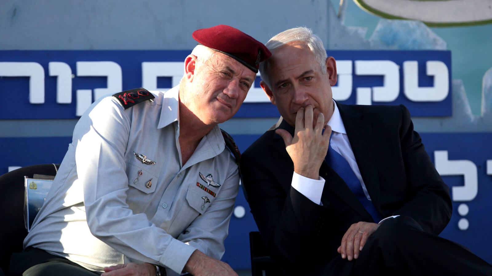 Israeli Prime Minister Benjamin Netanyahu, right, speaks with Israeli Chief of Staff Lt. Gen. Benny Gantz, during a graduation ceremony of navy officers in the northern port city of Haifa, Israel, Sept. 11, 2013. Dan Balilty | AP