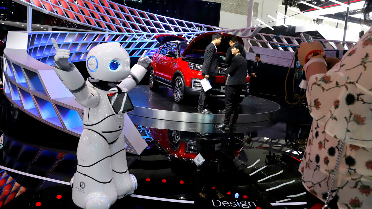 A robot entertains visitors at the booth of a Chinese automaker during the China Auto 2018 show in Beijing, China. Under President Xi Jinping, a program known as "Made in China 2025" aims to make China a tech superpower by advancing development of industries that in addition to semiconductors includes artificial intelligence, pharmaceuticals and electric vehicles. Ng Han Guan | AP