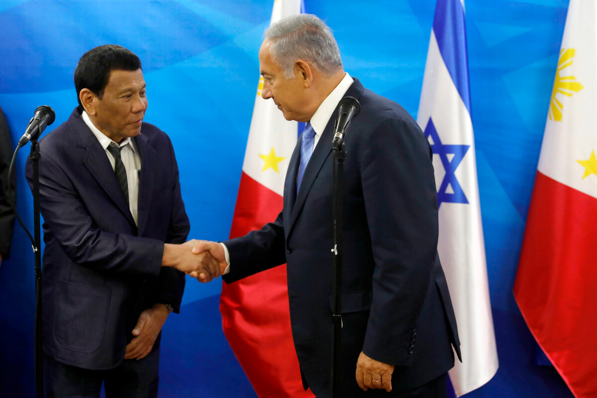 Israeli Prime Minister Benjamin Netanyahu, right, shakes hands with Philippine President Rodrigo Duterte during a meeting in Jerusalem on Sept. 3, 2018. Ronen Zvulun | AP
