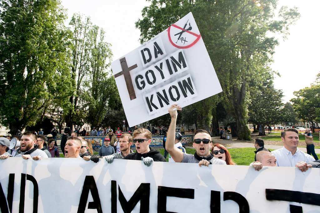 Robert Boman pictured holding an anti-Semitic sign at a protest in Berkeley, California. Photo | It’s Going Down