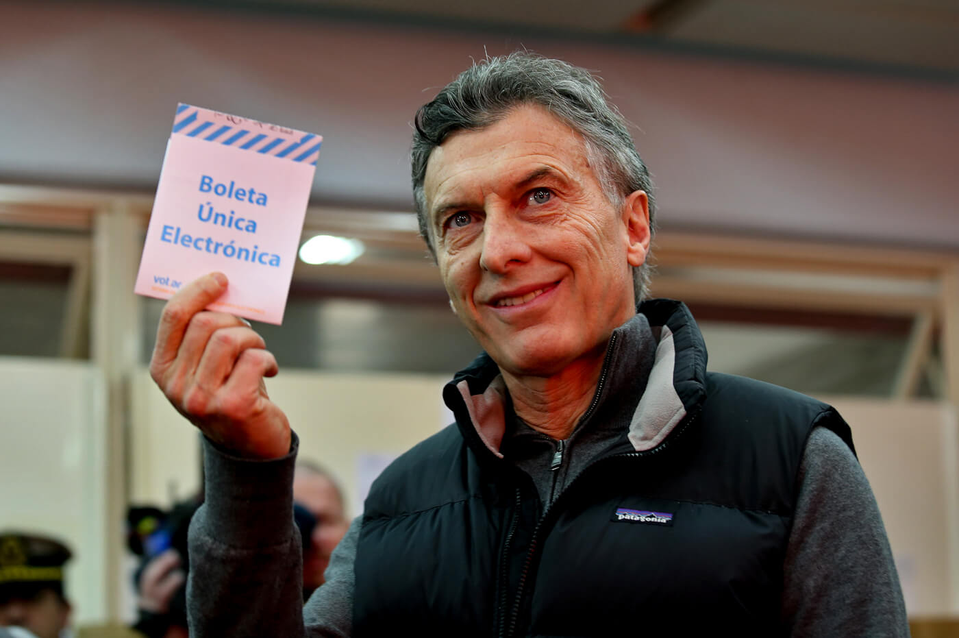 Mauricio Macri holds up a ballot which reads in Spanish “Unique Electronic Ballot” during mayoral elections in Buenos Aires, Argentina, July 5, 2015. Daniel Jayo | AP