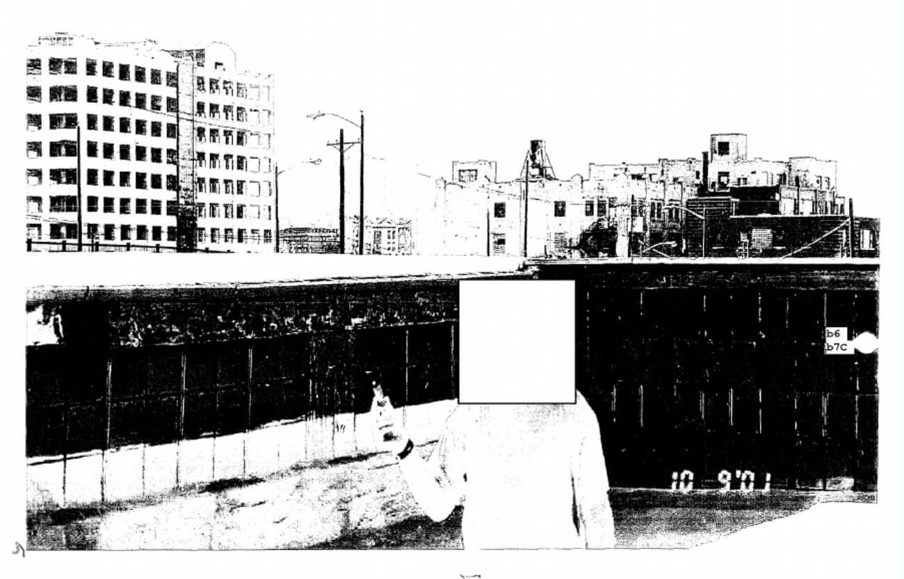 Sivan Kurzberg holds a lit lighter with the Manhattan skyline in the background. The date September 10, 2001 visible in the bottom right corner | Photo #5