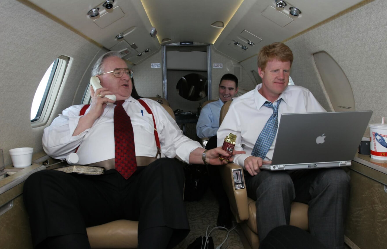 Jerry Falwell travels with his son Jonathan, right, aboard his private jet in 2004. Todd Hunley | Thomas Road Baptist Church