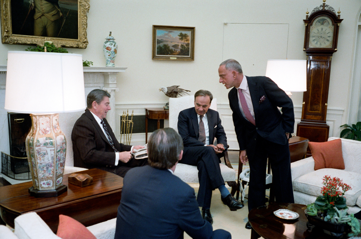 Reagan meets with Rupert Murdoch, U.S. Information Agency Director Charles Wick, and Roy Cohn in the Oval Office in 1983. Photo | Reagan presidential library