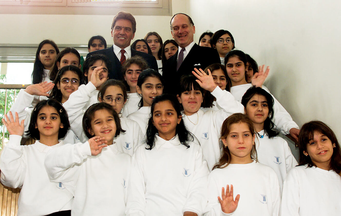 Ronald Lauder, right, and Austrian Chancellor Viktor Klima pose with students from the Lauder Chabad School in Vienna, Austria in 1999. Martin Gnedt | AP