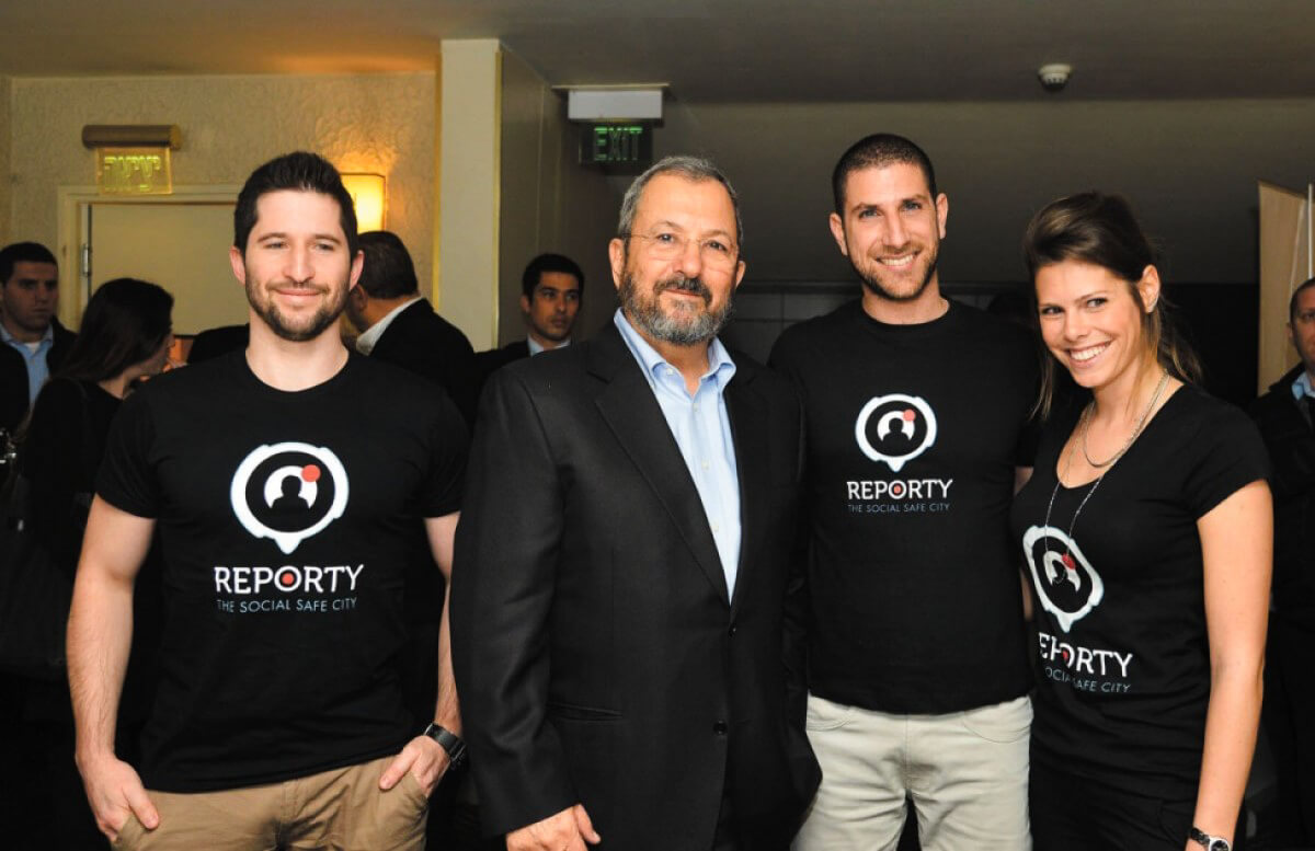 Ehud Barak, center, poses with Carbyne co-founders Alex Dizengof, Amir Elichai and Lital Leshem. Photo | Yossi Seliger