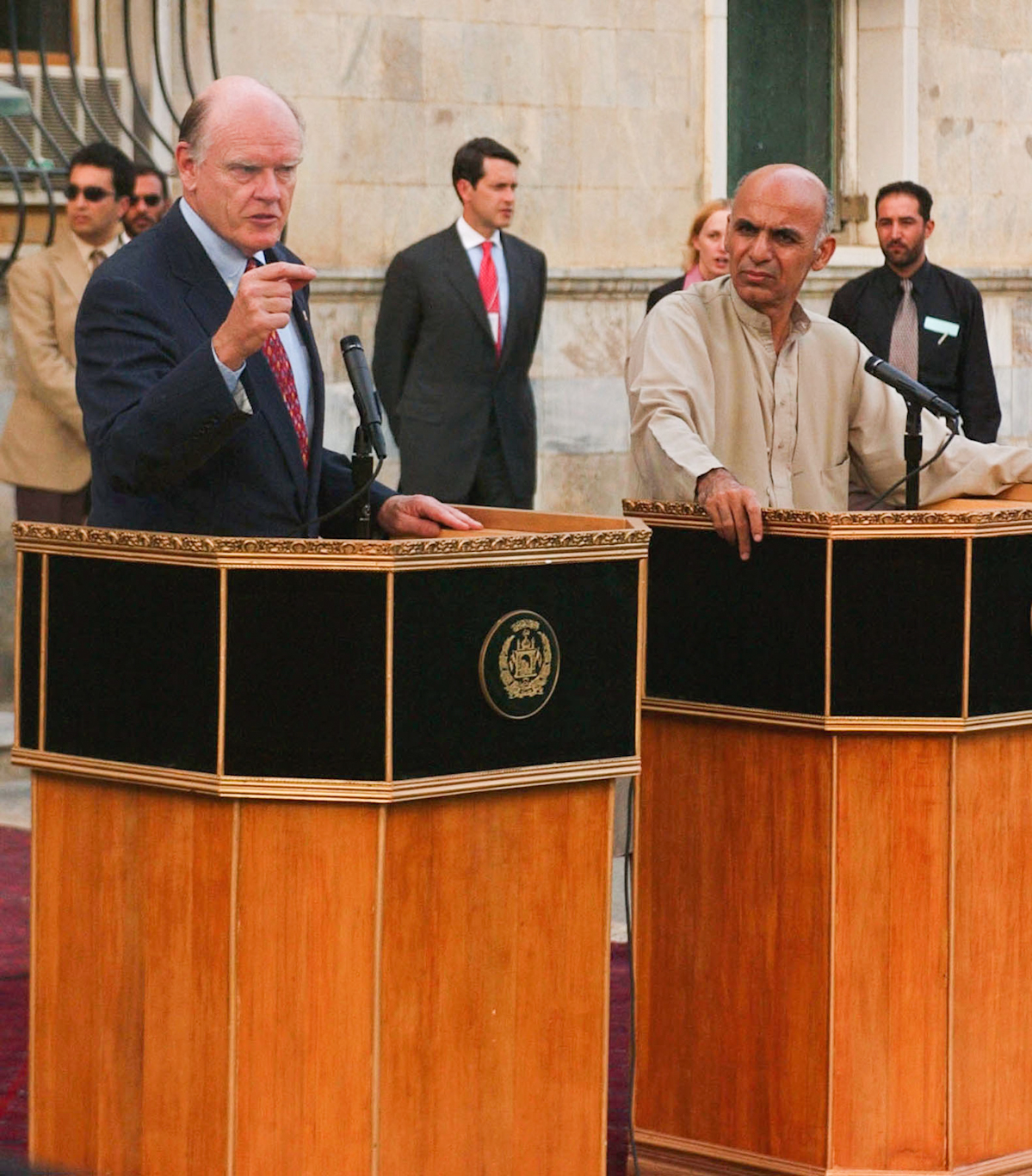 Bush’s Treasury Secretary John Snow, left, and now-Afghan President Ashraf Ghani after a meeting in Kabul, Sept. 18, 2003. Natacha Pisarenko | AP