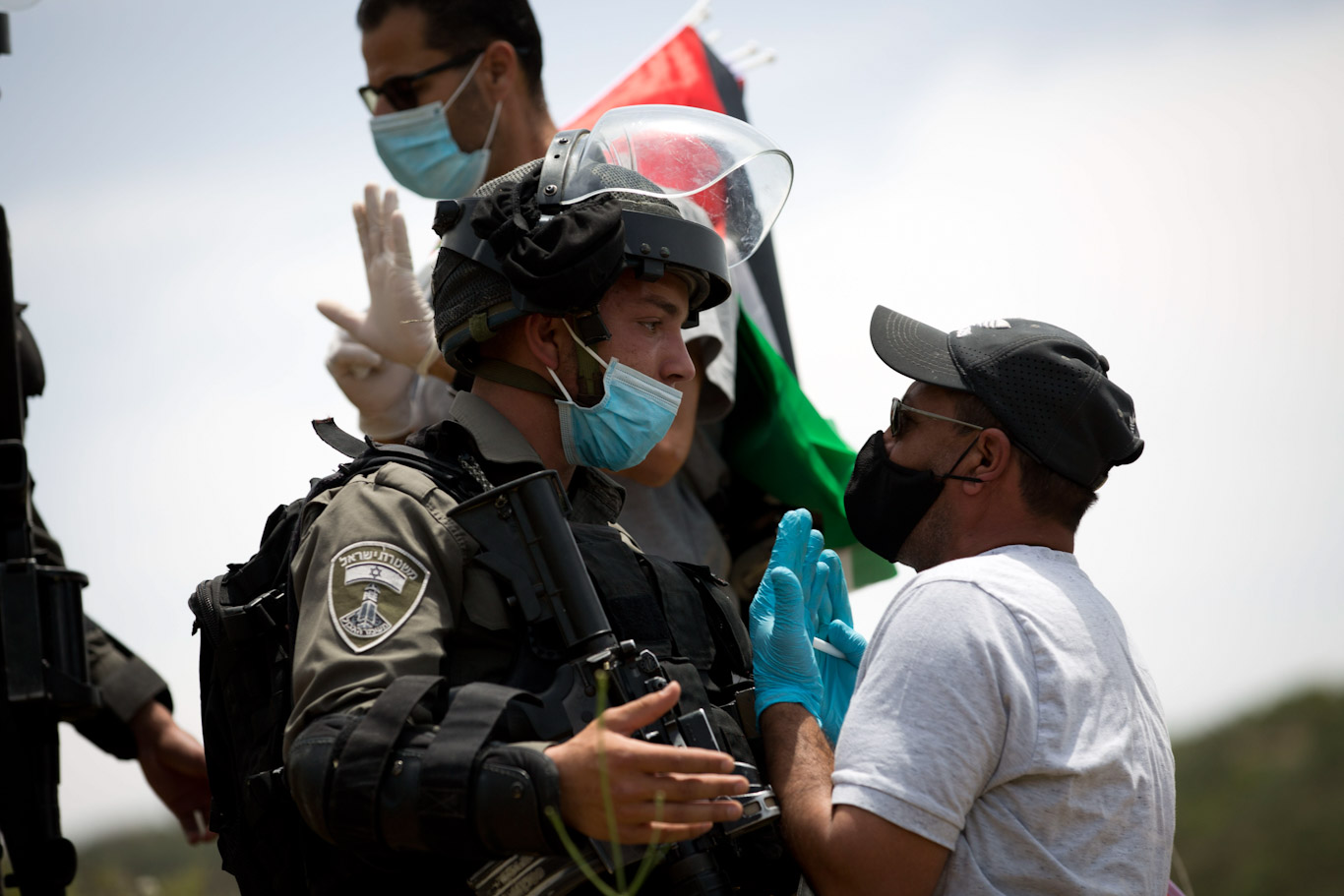 A Palestinian confronts Israeli police during a protest marking the 72nd anniversary nakba near Nablus, May 15, 2020. Majdi Mohammed | AP