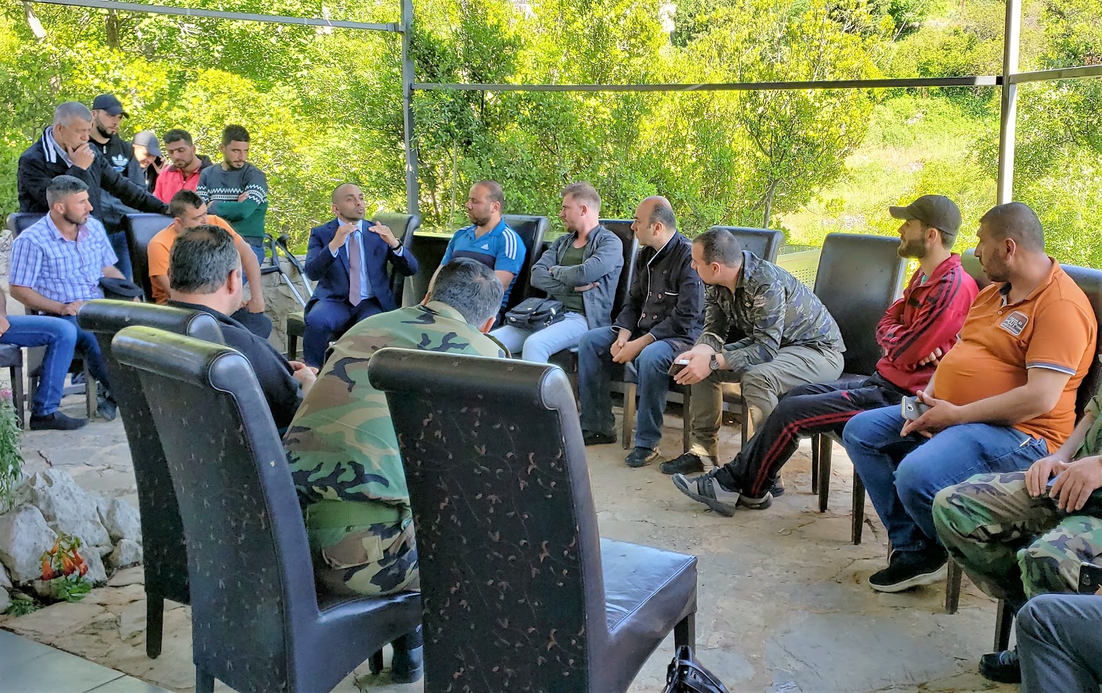 Wounded soldiers discussing their options after receiving vocational training. Photo | Eva Bartlett