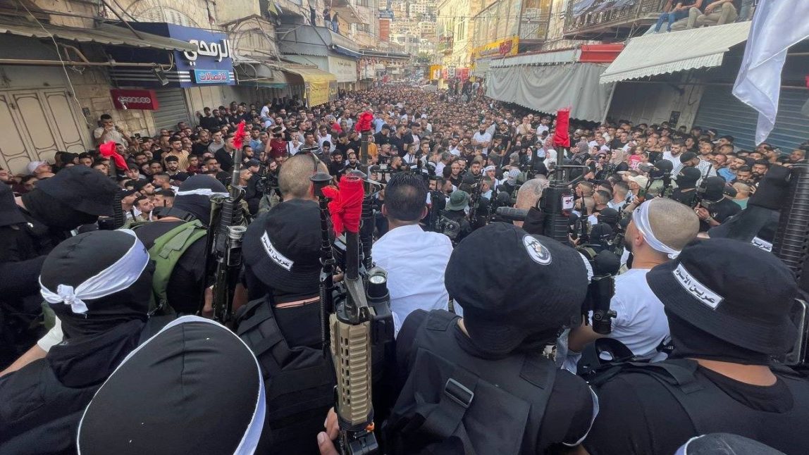 Palestinians including members of the Lion's Den militant group in the West Bank city of Nablus, Palestine, attend a memorial service for Mohammed al-Azizi and Abdul Rahman Sobh on Sep. 2, 2022.