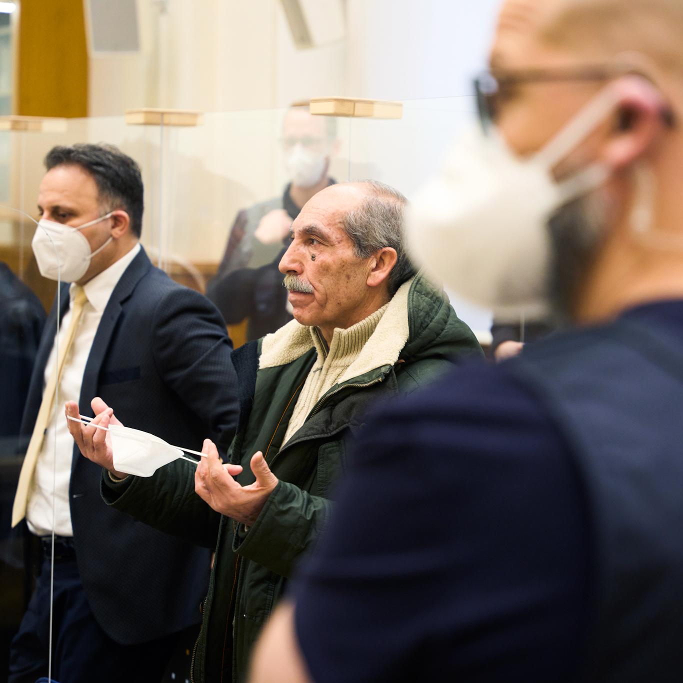 Anwar Raslan, center, stands in the courtroom at the Higher Regional Court in Koblenz, Germany, Jan. 13, 2022. Photo: Thomas Frey/AP.