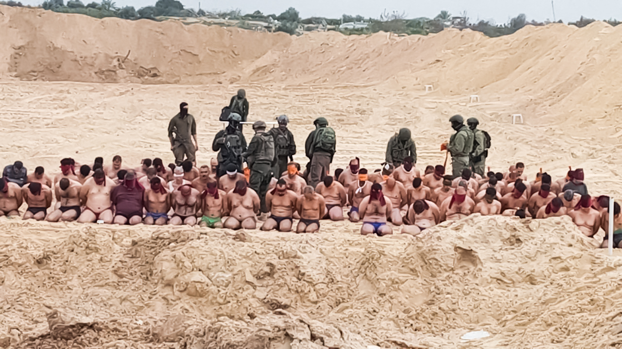 Israel forces strip and detain a group of men