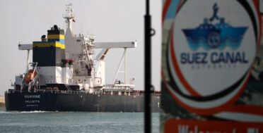 Large ship passes through the Suez Canal.
