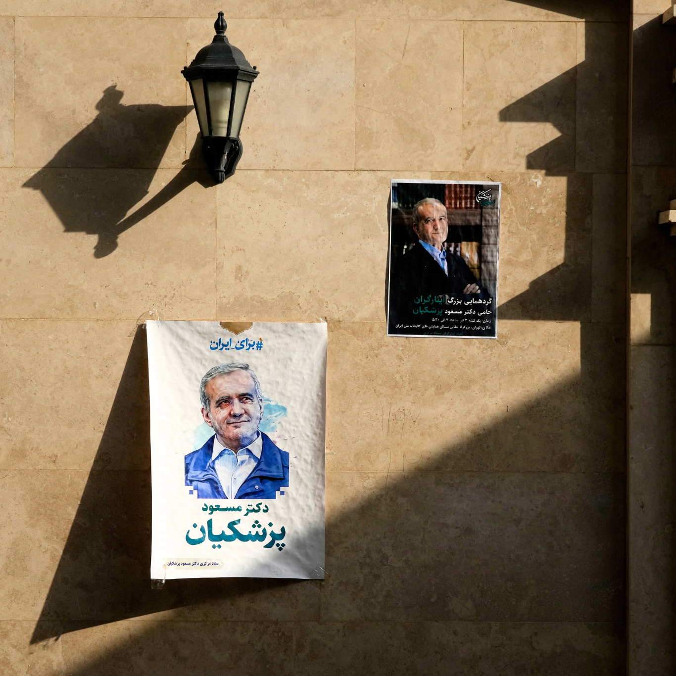 Posters of reformist candidate Masoud Pezeshkian at his Tehran HQ ahead of Iran’s presidential runoff, June 29, 2024. Vahid Salemi | AP