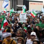 Iranian expats rally in Toronto on June 21, 2025, in support of exiled Crown Prince Reza Pahlavi following U.S. airstrikes on nuclear sites in Fordow, Natanz and Esfahan. Protesters waved pre-revolutionary flags and denounced the Islamic Republic. Sayed Najafizada | AP