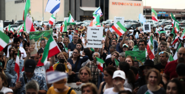 Iranian expats rally in Toronto on June 21, 2025, in support of exiled Crown Prince Reza Pahlavi following U.S. airstrikes on nuclear sites in Fordow, Natanz and Esfahan. Protesters waved pre-revolutionary flags and denounced the Islamic Republic. Sayed Najafizada | AP