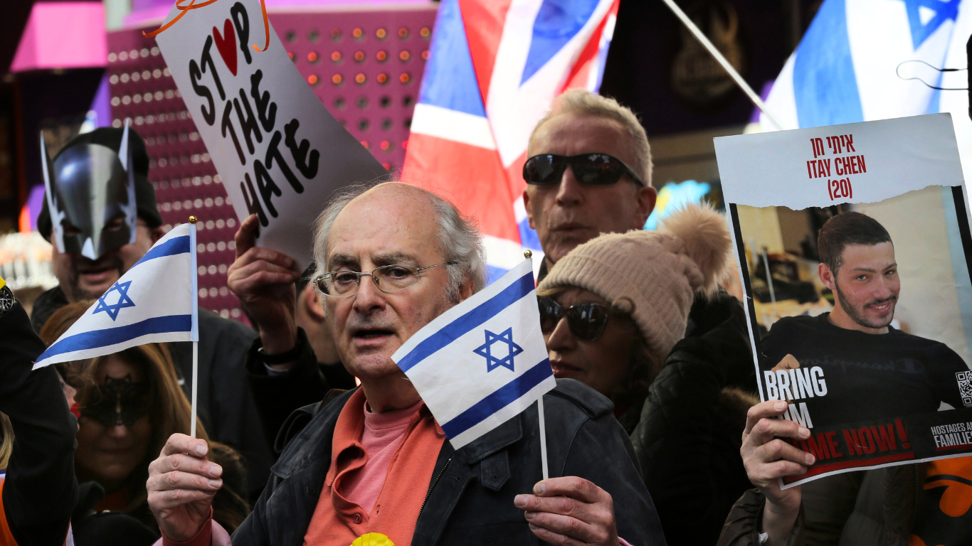 Pro-Israel demonstrators gather in London during a counter-protest to a pro-Palestinian rally, part of the wider mobilization that groups like Stop The Hate UK have sought to amplify as they pressure authorities to crack down on anti-genocide activism. (Photo by Martin Pope / SOPA Images/Sipa USA)(Sipa via AP Images)