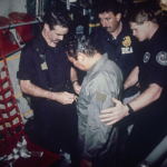 Manuel Antonio Noriega watches as U.S. Drug Enforcement Agents place chains around his waist aboard a C-130 transport plane on Jan. 4, 1990. Noriega surrendered to U.S. authorities in Panama City and was flown to Miami, Florida, where he faced drug trafficking charges. Photo | AP
